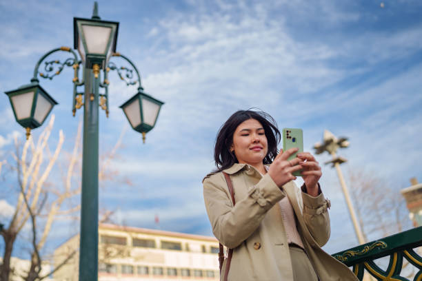 istock Portrait an Asian Woman using mobile phone, Travels in Town. 2024910711