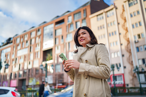 Part of a Series of an Asian Woman, Travels in Town.