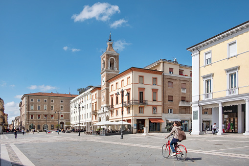 Rimini, Italy - May 11, 2023: tranquil views of the Piazza Tre Martiri, the historic town center, visited by locals and tourists alike featuring a blend of old roman, medieval and modern architecture.