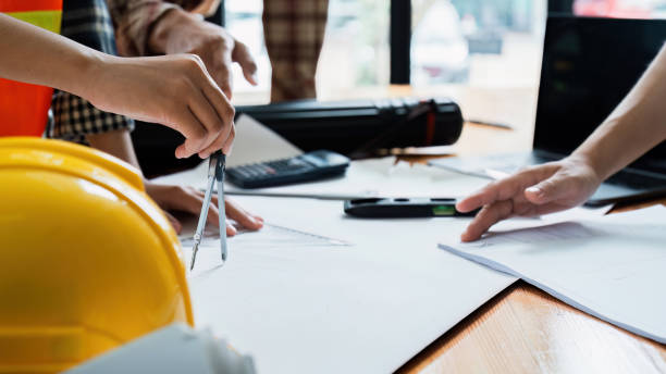 istock team engineer, foreman, architect meeting for colleagues discussing and checks construction blueprints at onsite 2024961508