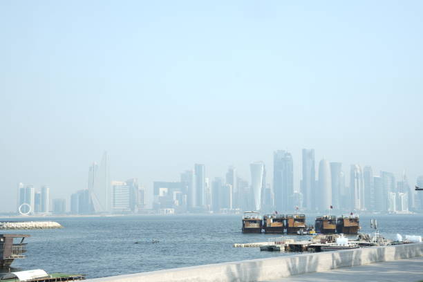 Futuristic Modern Skyline with Reflection in the Still Corniche Bay Waters, Last of the Sunlight Falling on the Buildings.
