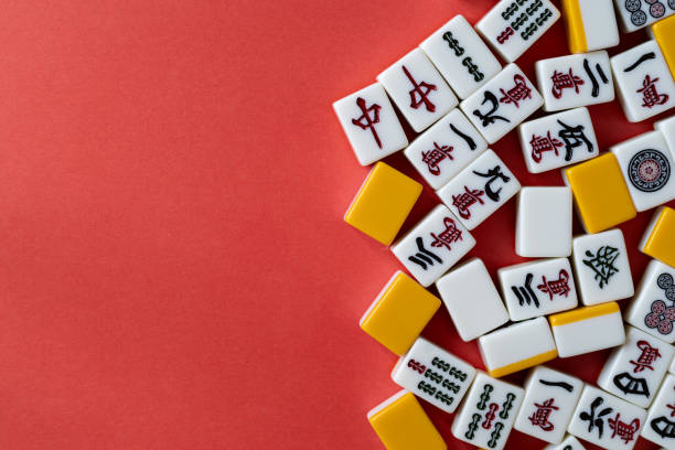istock mahjong tiles on red background 2024972337
