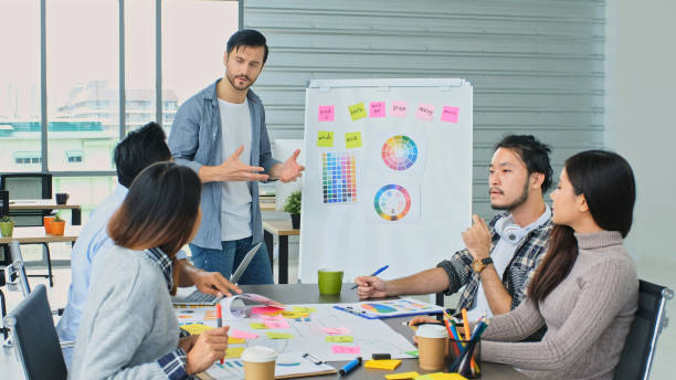 istock Young creative design meeting brainstorm ideas to plan and develop project together in office, Small business startup coworker 2024973430