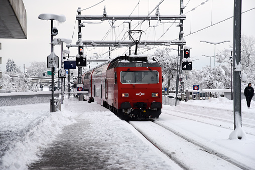 S4 S-Bahn at Zurich Saalsporthalle / ShihlCity captured during winter season after heavy snowing.