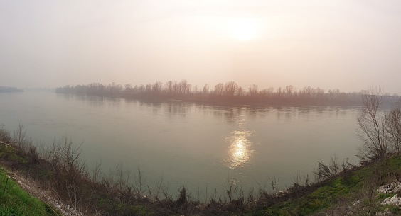 Panoramic view from the riverbank of the Po river in Cremona near the famous old iron bridge