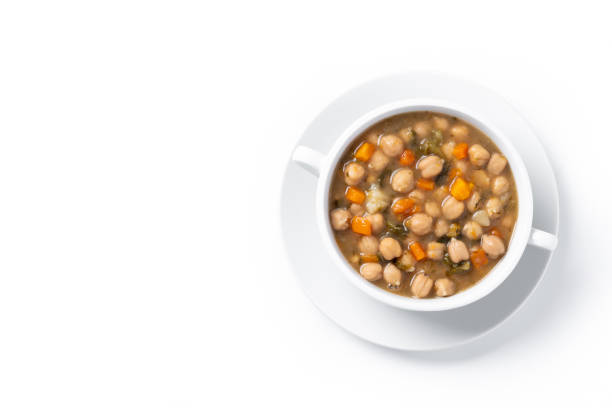 Chickpeas soup with vegetables in bowl isolated on white background