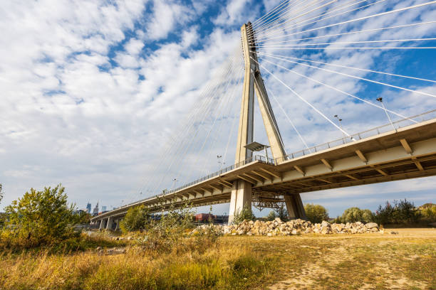 Warsaw, Poland - October 14 2023: Beautiful and big Swietokrzyski road bridge cable-stayed, put into operation in 2000, with lanes for pedestrians and cyclists on both sides of the structure