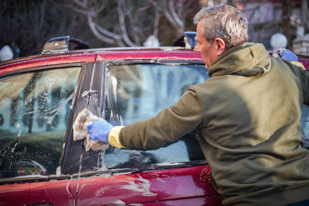 istock DIY, the man washes the car himself 2025051091