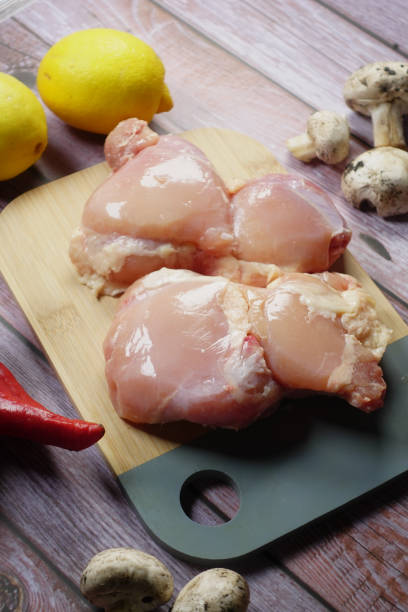 istock raw breast chicken meat on a chopping board 2025059728