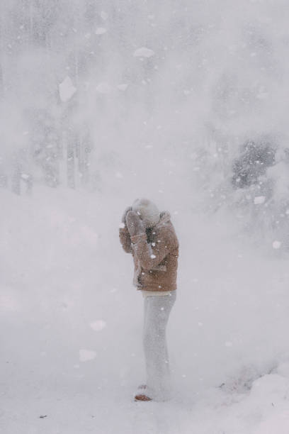 girl in the forest with falling snow