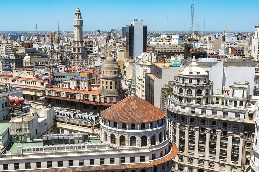 High angle view of Buenos Aires showcasing the city's diverse architecture under the clear blue sky.