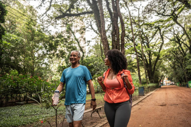 istock Father and daughter talking and walking on the public park 2025071926