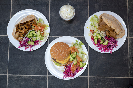 Spicy Chicken and Lamb Donner Kebabs in Pita Bread and a tasty Cheeseburger with side salad