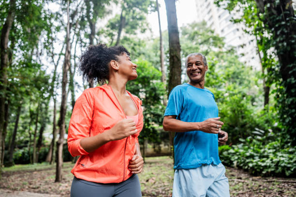 istock Father and daughter talking and running on the public park 2025078974