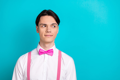 Photo portrait of pretty young male look empty space promo dressed stylish pink outfit isolated on aquamarine color background.