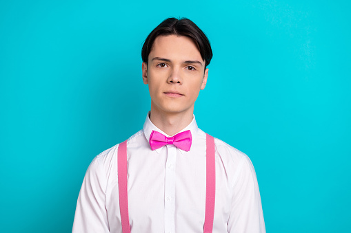 Photo portrait of attractive young man look camera promo dressed stylish pink clothes isolated on aquamarine color background.