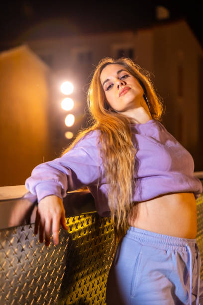 istock Blonde beauty trap dancer posing leaning on a urban rail 2025094367