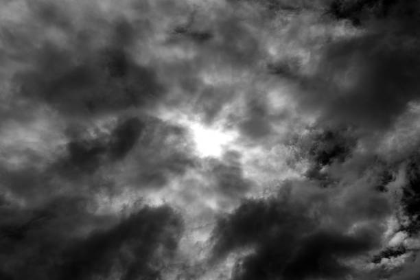 Dramatic stormy sky background. Dark gray fluffy cloudy sky. Cloudscape background concept. Rainy season background. Thunderstorm concept.
