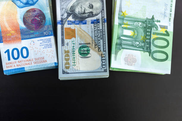 istock Three piles of money on the table 2025099871