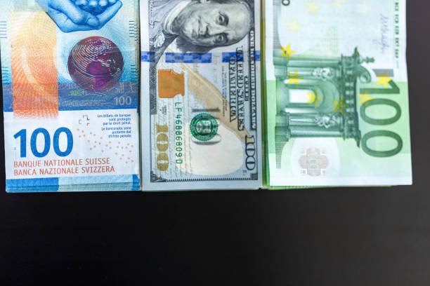 istock Three piles of money on the table 2025100381