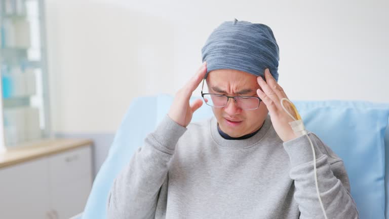 male cancer patient has headache