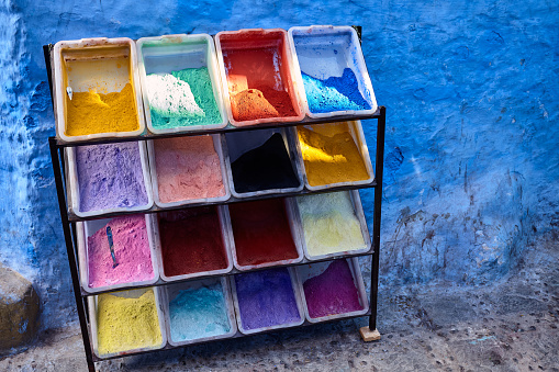 Street with colourful powdered pigments in the markets of the Medina in Chefchaouen, Morocco, North Africa.