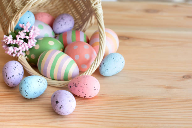 istock Basket with Easter colorful eggs on wooden table 2025113667