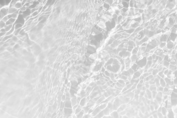 istock White water surface texture with ripples, splashes, and bubbles. Abstract summer banner background Water waves in sunlight with copy space cosmetic moisturizer micellar toner emulsion. White water. 2025120689