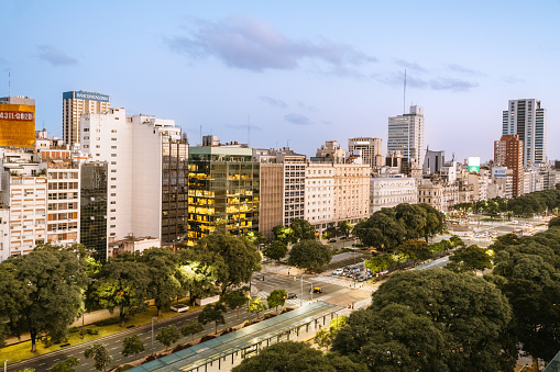 Twilight view of Buenos Aires skyline showcasing city lights and architectural details in Argentina's vibrant capital.