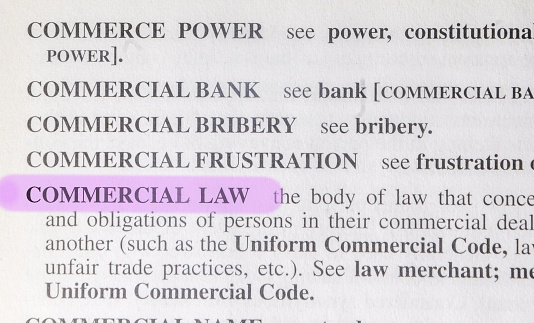 close up photo of the words commercial law