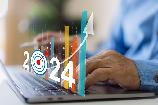 Human with 2024 new year target sale profit and arrow business financial investment graph, business growth, money, 2024, chart, target, investment, funds, saving money, banking, marketing and profit