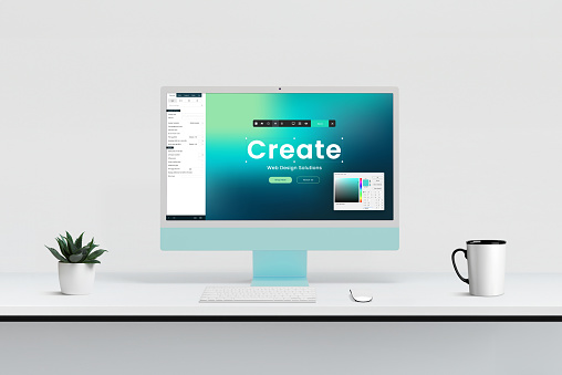 Modern web design studio with computer display showcasing site creation editor, tools, and color picker for efficient and creative website development