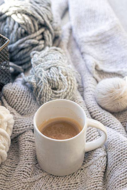 istock Close-up, cup of coffee, knitted element and yarn threads. 2025155142