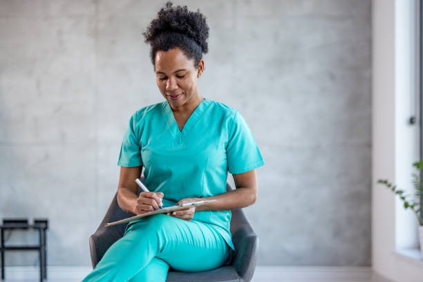 istock Nurse working at the hospital writing on a clipboard 2025173411