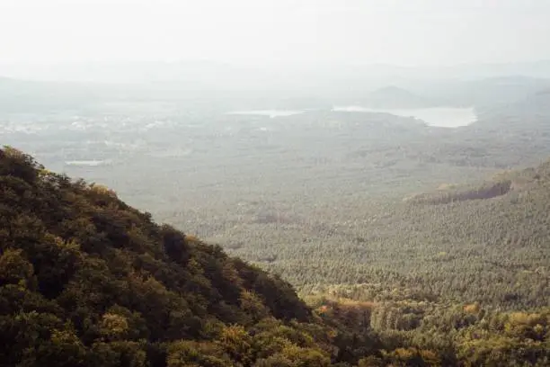 Photo of landscape with Machovo jezero from Bezdez castle 13. October 2023 on analogue photography - blurriness and noise of scanned 35mm film were intentionally left in image