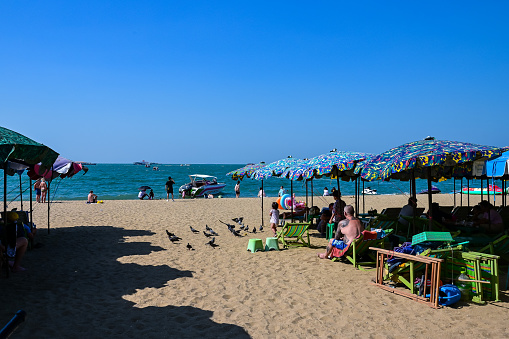 Pattaya Beach with lots of tourists and beach activities before New Year's Eve 2023