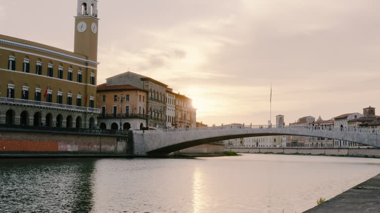 Arno River and Ponte di Mezzo, Lungarno Boulevard at sunset in Pisa, Tuscany, Italy