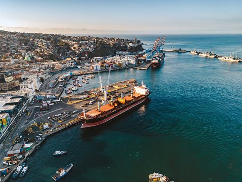 drone view on Harbor and Cityscape of Valparaiso – Chile, Container ships anchoring at the pier