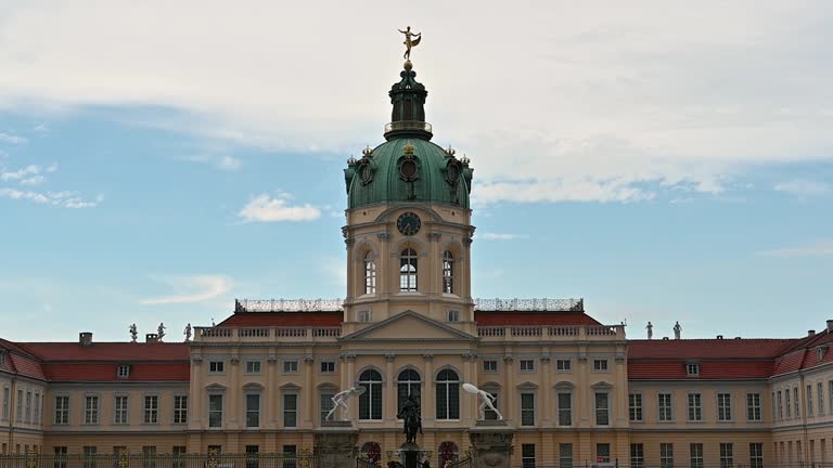 Berlin, Germany 10 August, 2023: Slow motion footage at the entrance gate of Charlottenburg Palace. Tilt movement.