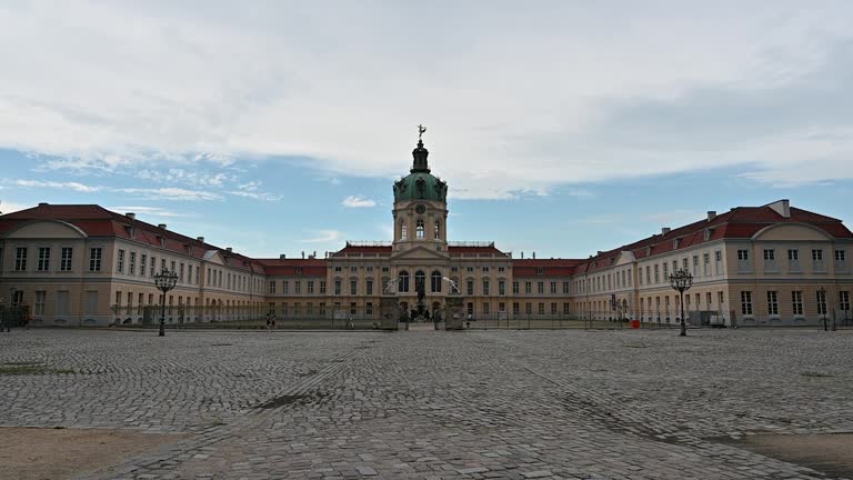 Berlin, Germany 10 August, 2023: Slow motion footage at the entrance gate of Charlottenburg Palace. Tilt movement.