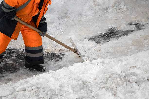 istock A man with a snow shovel cleans sidewalks in winter. 2025236408