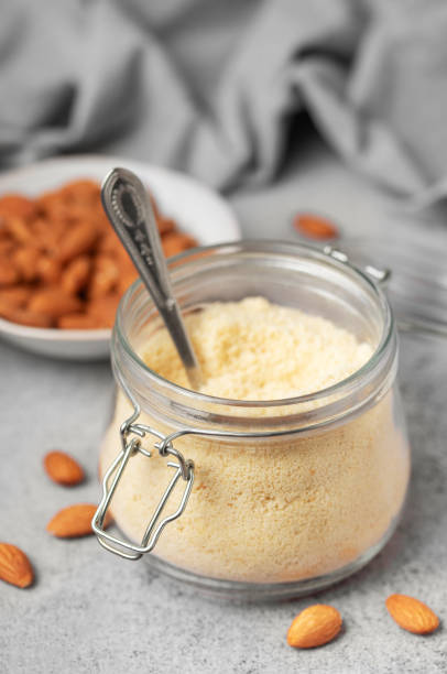 istock Fresh almond flour in a  glass jar and almonds 2025243174