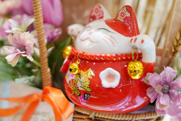 istock Maneki neko cat waving with paw close up 2025244544