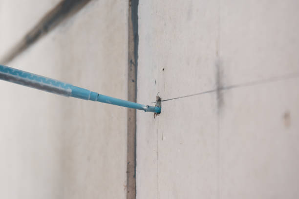 istock Filling concrete wall with adhesive, preparation for core drilling 2025250632