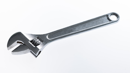 Adjustable wrench on white background