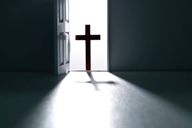 istock Open door with a religious cross 2025257789
