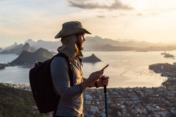 istock Man using his smartphone on top of the mountain after hiking 2025278793