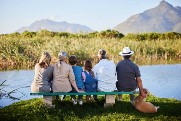 istock Multi-generation family looking at the view outside in a nature reserve 2025283570