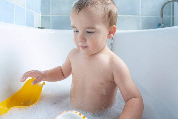 istock two-year-old playing in the bathtub 2025287279