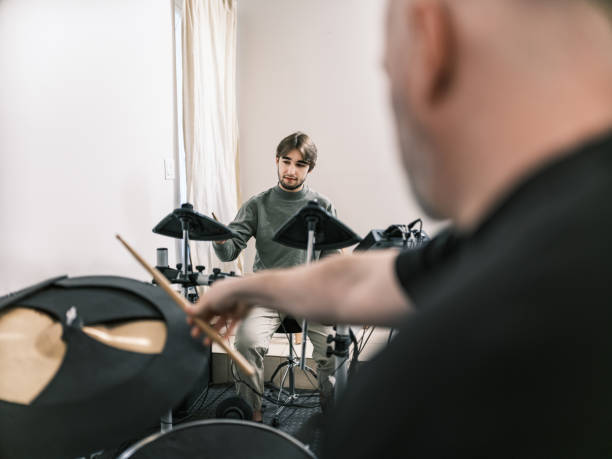 istock Male music teacher at drumming music studio 2025288361
